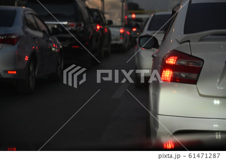 traffic jam on night road, car driving in rush hour of city life traffic jam on night road, car driving in rush hour of city life 61471287