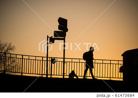 man walking with backpack on the bridge man walking with backpack on the bridge 61473684