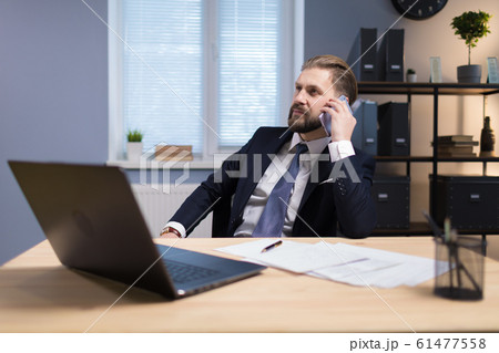 Mature Office Worker Having a Telephone Conversation 61477558