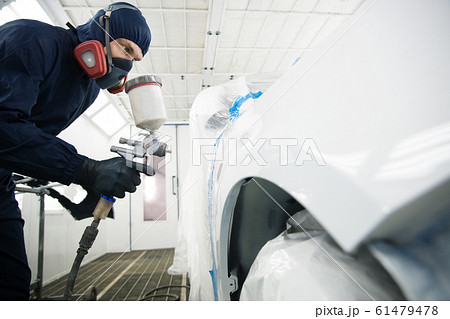 worker with spray gun in spray booth worker with spray gun in spray booth 61479478