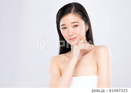 Portrait beautiful young asian woman clean fresh bare skin concept. Portrait beautiful young asian woman clean fresh bare skin concept. 61487325