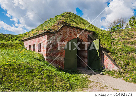 Bunker covered with ground and grass, dugout made 61492273