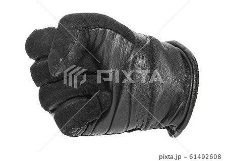 gloved hand clenched into a fist gloved hand clenched into a fist 61492608