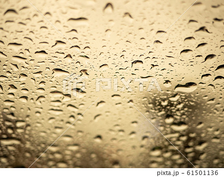Close up view of water drops falling on glass 61501136