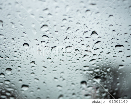 Close up view of water drops falling on glass 61501149