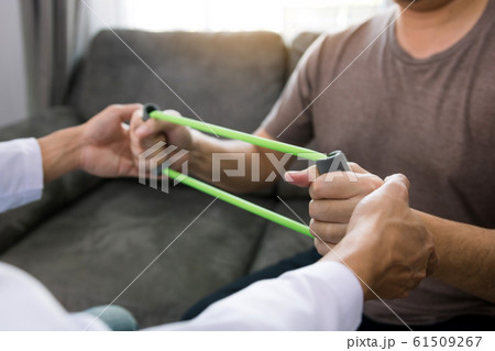 Close up hand patient doing stretching exercise 61509267