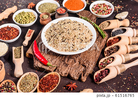 Spices and herbs over black stone background 61516765