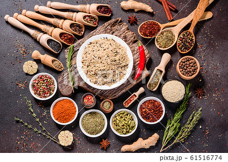 Spices and herbs over black stone background Spices and herbs over black stone background 61516774