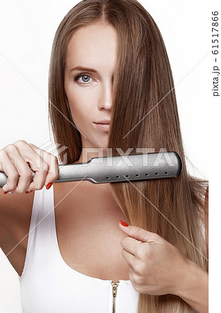 A beautiful young girl in a white blouse A beautiful young girl in a white blouse 61517866