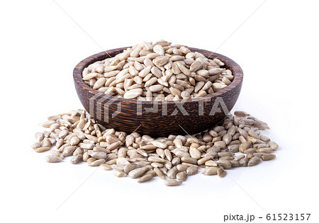 sunflower seeds in wood bowl isolated on white sunflower seeds in wood bowl isolated on white 61523157