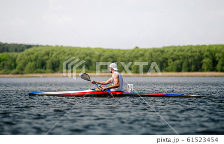 male athlete kayaker rowing male athlete kayaker rowing 61523454