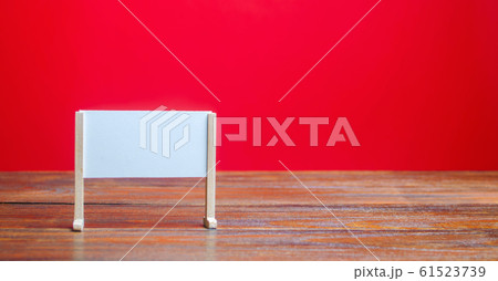 Stand or white board on a red background. Empty whiteboard. Minimalism. Business process concept, strategy planning at meetings and briefings. Education, presentation, message, creative platform 61523739