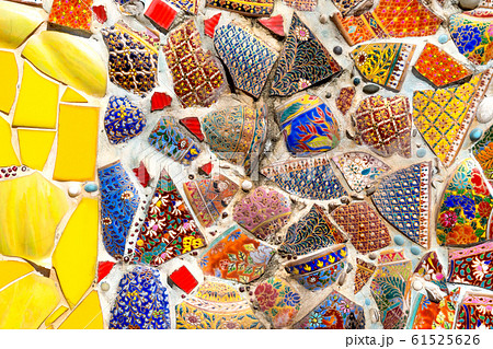 Abstract wall background decorated from colorful tile scrap and pottery. Abstract wall background decorated from colorful tile scrap and pottery. 61525626