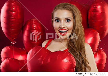 Happy young woman with red balloons. Birthday Happy young woman with red balloons. Birthday 61526538