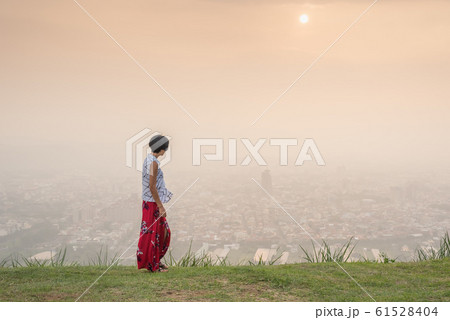 traveling asian mature woman walking 61528404