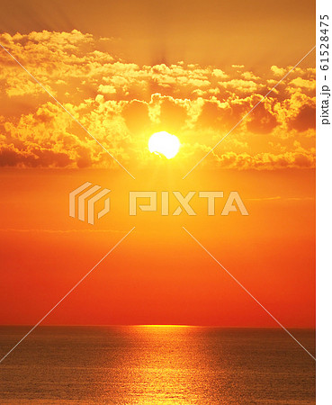 Bright sun rise over the sea. Bright sun rise over the sea. 61528475
