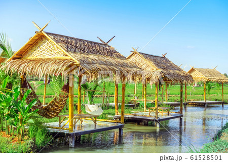 The resting huts constructed from bamboo and thatched roofs for relaxing in the rice fields. The resting huts constructed from bamboo and thatched roofs for relaxing in the rice fields. 61528501