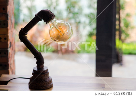 Antique lamp on table 61530782