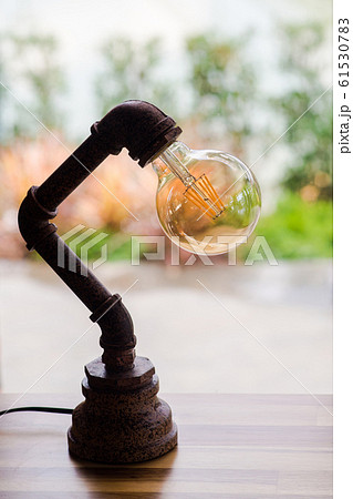 Antique lamp on table 61530783