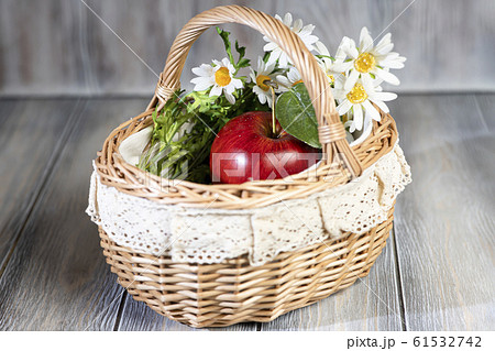 Red juicy ripe apple lie in basket. Red juicy ripe apple lie in basket. 61532742