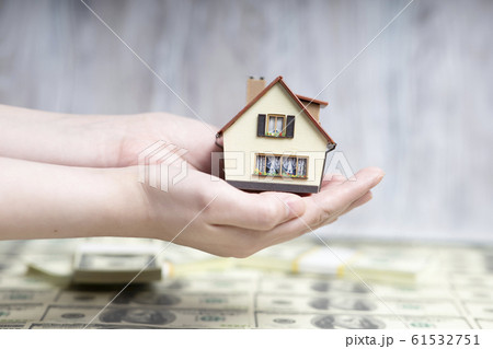 The man in his hands holds a small copy of the The man in his hands holds a small copy of the 61532751