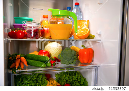 Open fridge. Healthy food. Vegetables and fruits Open fridge. Healthy food. Vegetables and fruits 61532897