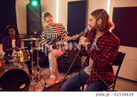 Group of Young People Playing Music in Studio Group of Young People Playing Music in Studio 61536639