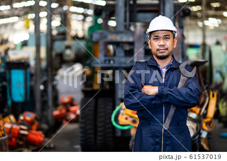 Portrait of Asian mechanic Fold over holding a maintenance tools Portrait of Asian mechanic Fold over holding a maintenance tools 61537019