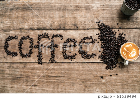 Coffee bean texture word with latte coffee Coffee bean texture word with latte coffee 61539494