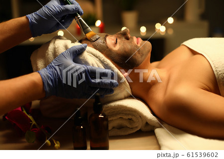 Close-up of a woman performing therapeutic procedures in a health Spa. Body care in a luxurious massage Spa. 61539602
