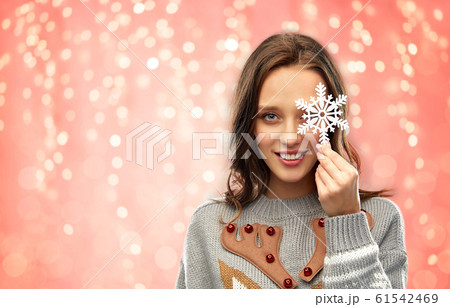 woman in christmas sweater with snowflake woman in christmas sweater with snowflake 61542469