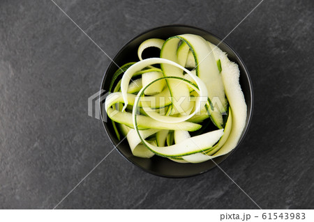 peeled or sliced zucchini in ceramic bowl 61543983
