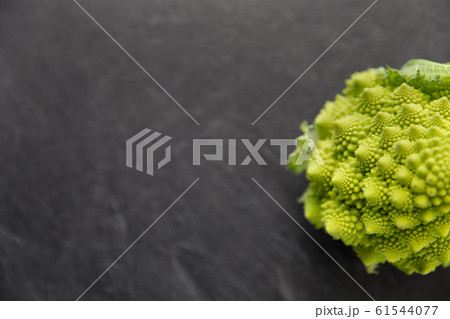 close up of romanesco broccoli on slate stone 61544077