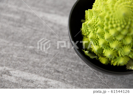 close up of romanesco broccoli in bowl 61544126
