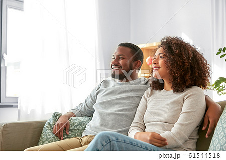 happy african american couple hugging at home 61544518