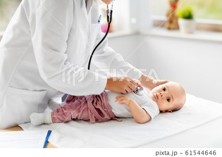 doctor with stethoscope listening to baby patient doctor with stethoscope listening to baby patient 61544646