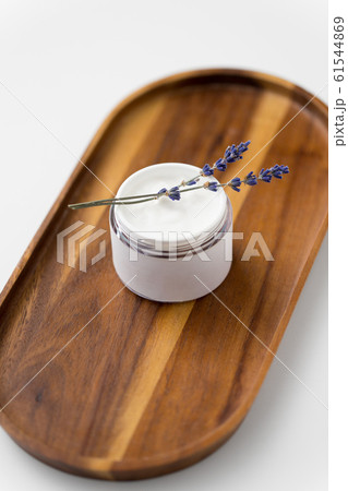 close up of lavender moisturizer on wooden tray 61544869
