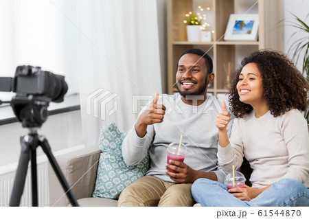 couple of video bloggers with camera at home couple of video bloggers with camera at home 61544870
