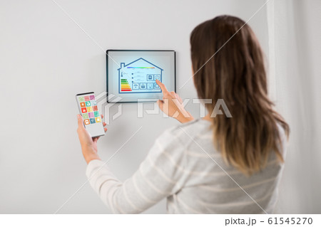 woman using tablet computer and smartphone woman using tablet computer and smartphone 61545270