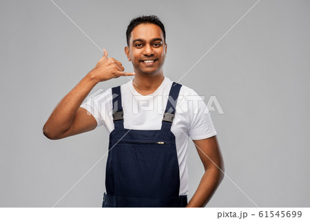 happy worker or builder making phone call gesture happy worker or builder making phone call gesture 61545699