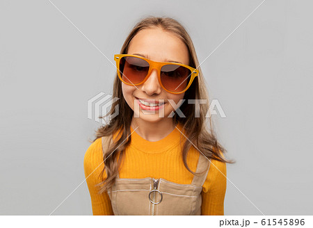 smiling young teenage girl in sunglasses smiling young teenage girl in sunglasses 61545896