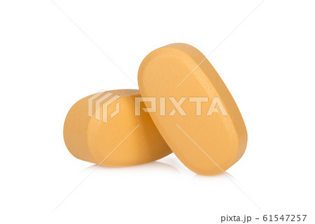 brown pills isolated on white background brown pills isolated on white background 61547257