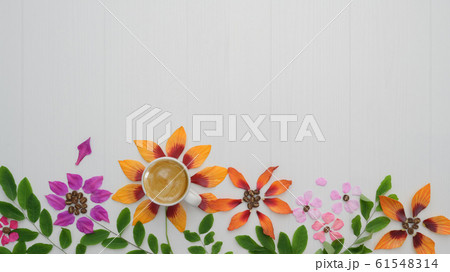 Top view of coffee cup with flower petals, leaves 61548314