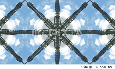 View to the Eiffel Tower on sky background, artistic kaleidoscopic effect View to the Eiffel Tower on sky background, artistic kaleidoscopic effect 61550169