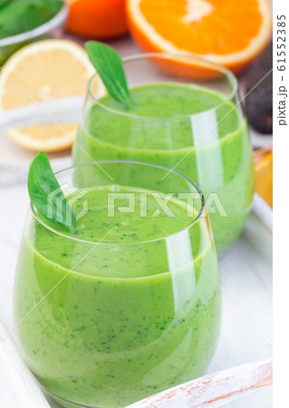 Green detox smoothie with avocado, spinach Green detox smoothie with avocado, spinach 61552385