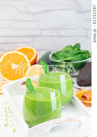 Green detox smoothie with avocado, spinach Green detox smoothie with avocado, spinach 61552387
