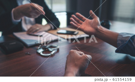 Police officer interrogating suspect or criminal Police officer interrogating suspect or criminal 61554159