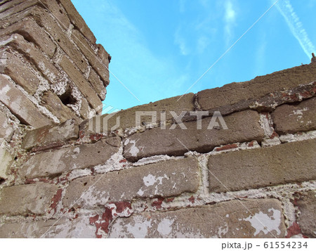 Old brick fence. 61554234