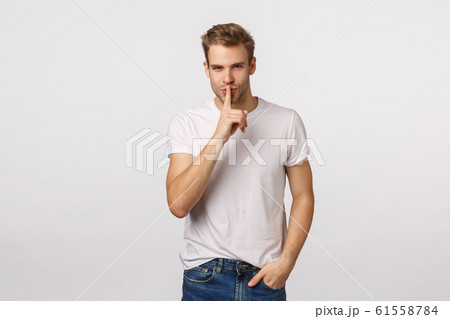 Sensual and creative, charming mysterious handsome blond man prepare secret for girlfriend, want make surprise, shushing with flirty smile, look camera, press index finger to lips, hush gesture Sensual and creative, charming mysterious handsome blond man prepare secret for girlfriend, want make surprise, shushing with flirty smile, look camera, press index finger to lips, hush gesture 61558784