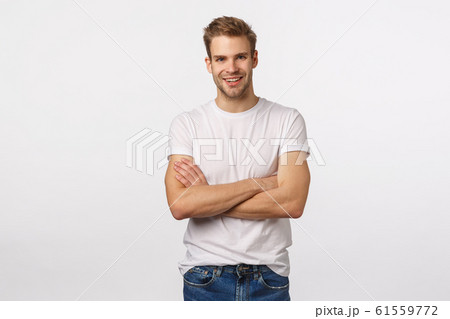 Enthusiastic, happy smiling blond man with bristle, white t-shirt, jeans, cross arms chest and grinning amused, hear interesting story, accepting good idea, agree with person, white background Enthusiastic, happy smiling blond man with bristle, white t-shirt, jeans, cross arms chest and grinning amused, hear interesting story, accepting good idea, agree with person, white background 61559772